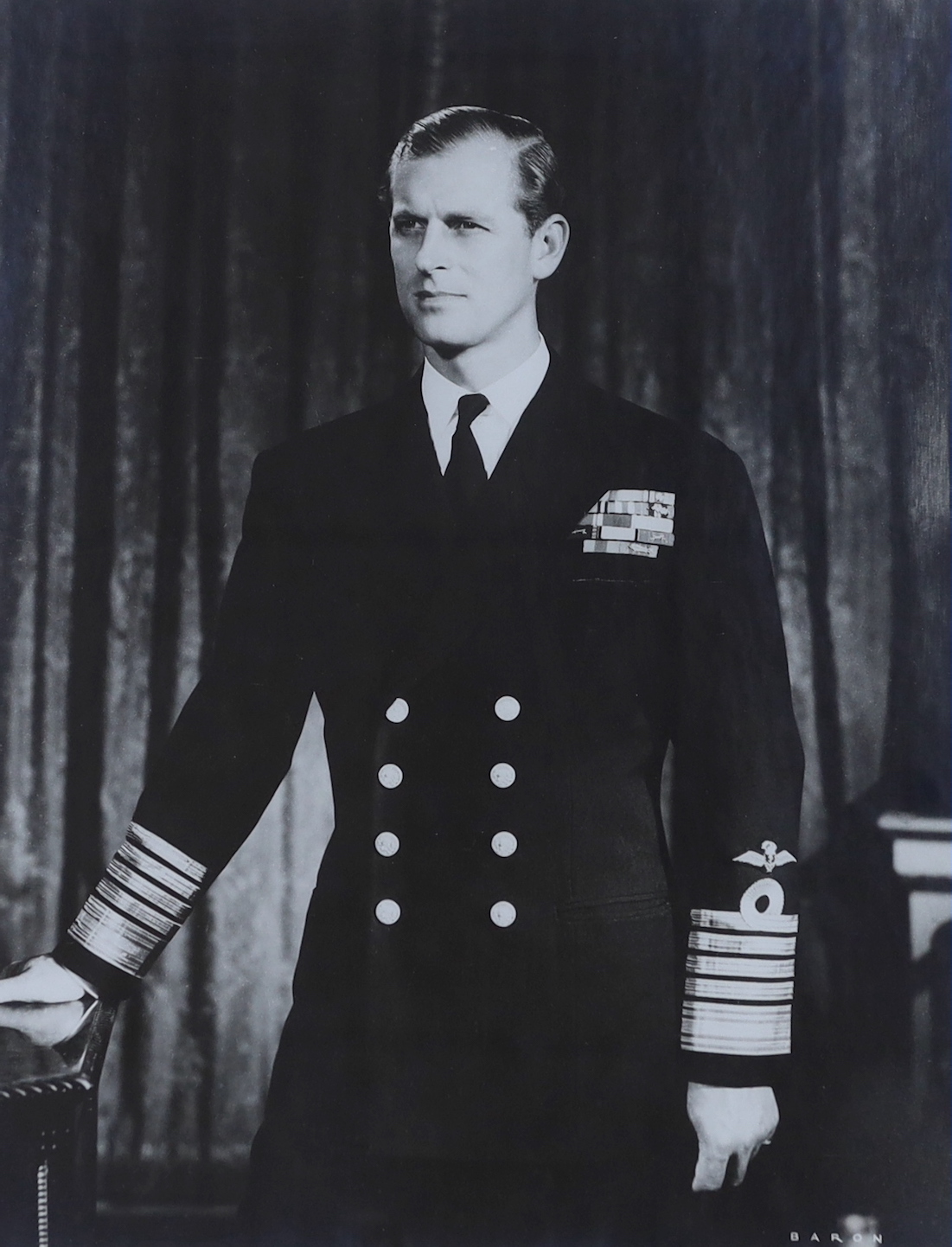 A signed black and white portrait photograph, Prince Philip, by Baron, dated 1955, 43cm wide x 56cm high